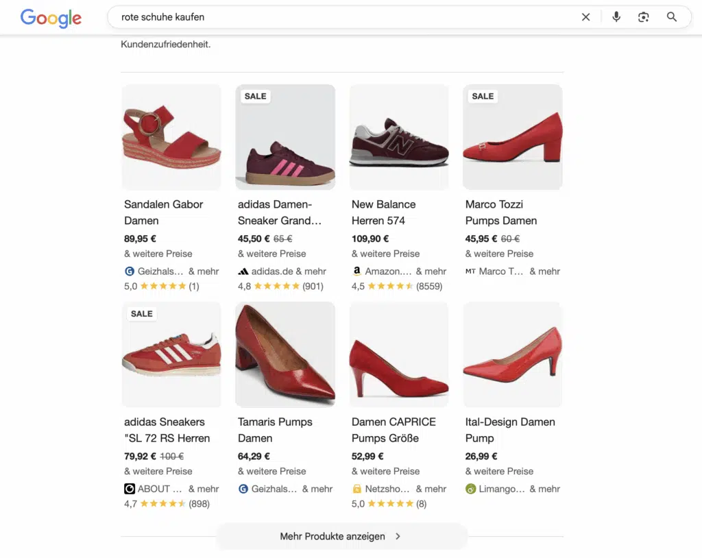 Google-Shopping-Ergebnisseite zur Suchanfrage „rote Schuhe kaufen“. Gezeigt werden neun rote Schuhmodelle verschiedener Marken, darunter Sandalen, Sneaker und Pumps für Damen und Herren. Beispiele sind Sandalen von Gabor, Sneaker von Adidas und New Balance, sowie Pumps von Marco Tozzi, Tamaris und Ital-Design. Preisangaben und Nutzerbewertungen sind unter den Bildern sichtbar. Einige Produkte sind mit einem „SALE“-Hinweis gekennzeichnet.